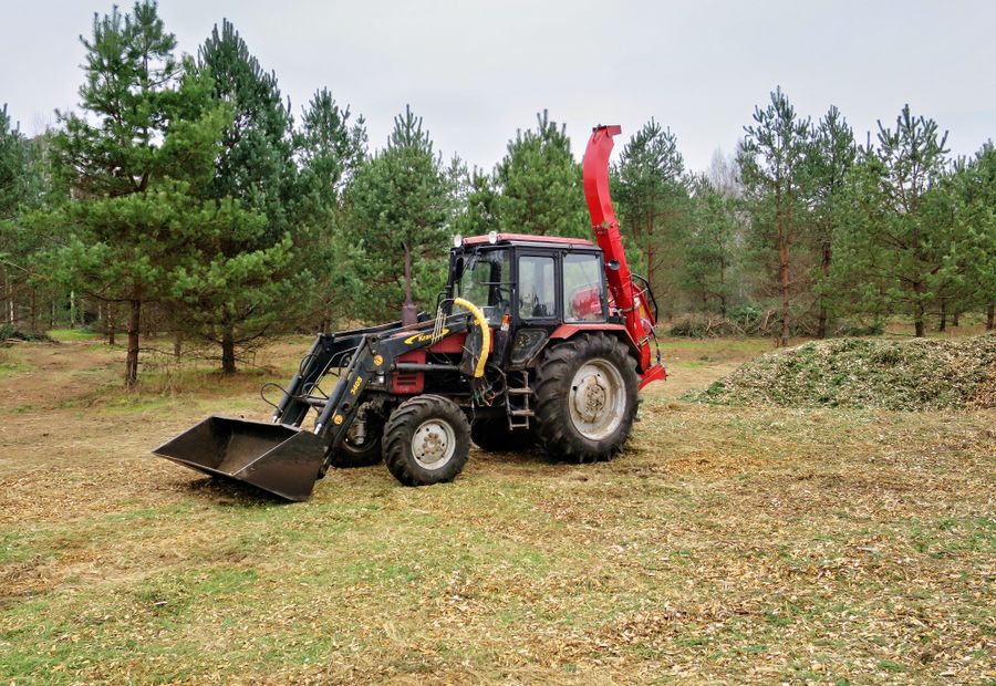 Forestry mulcher grinding standing brush into chips on Arkansas River Valley acreage